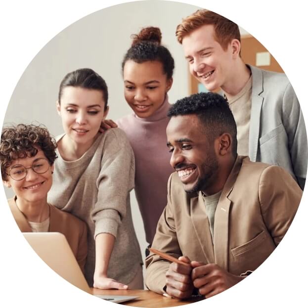 people around a laptop